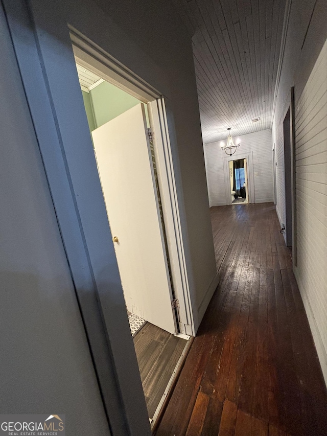 corridor with dark hardwood / wood-style floors