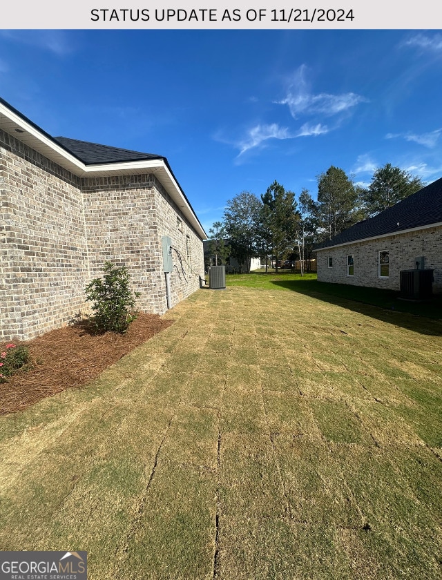 view of yard featuring central AC