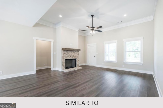 unfurnished living room featuring a fireplace, dark wood-type flooring, ceiling fan, and crown molding