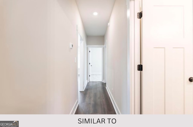 corridor featuring dark wood-type flooring