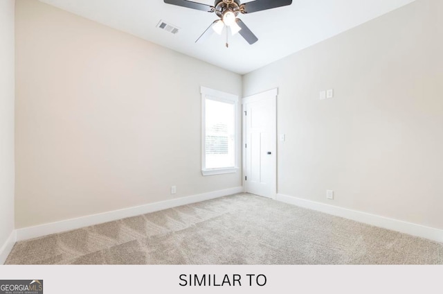 empty room with light carpet and ceiling fan