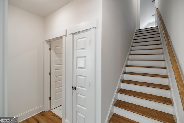 170 New High Shoals Rd, Watkinsville, GA 30677 - staircase featuring wood finished floors and baseboards