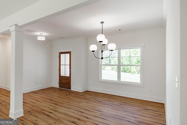 170 New High Shoals Rd, Watkinsville, GA 30677 - foyer entrance featuring wood finished floors, baseboards, ornamental molding, and a chandelier