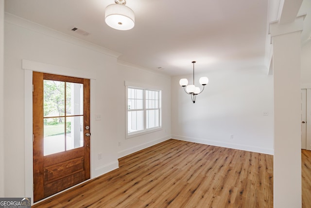 170 New High Shoals Rd, Watkinsville, GA 30677 - entryway with light wood-style flooring, crown molding, baseboards, and a chandelier