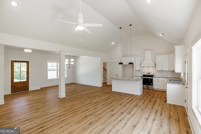 170 New High Shoals Rd, Watkinsville, GA 30677 - kitchen featuring open floor plan, stainless steel electric range oven, custom range hood, a center island, and high vaulted ceiling