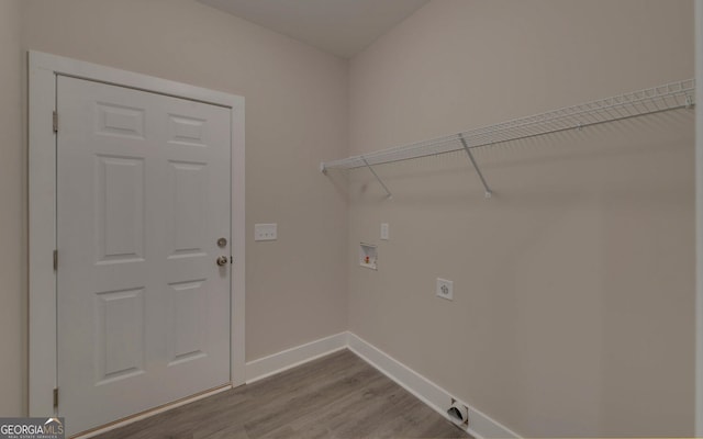 washroom with hookup for a washing machine, baseboards, wood finished floors, laundry area, and hookup for an electric dryer