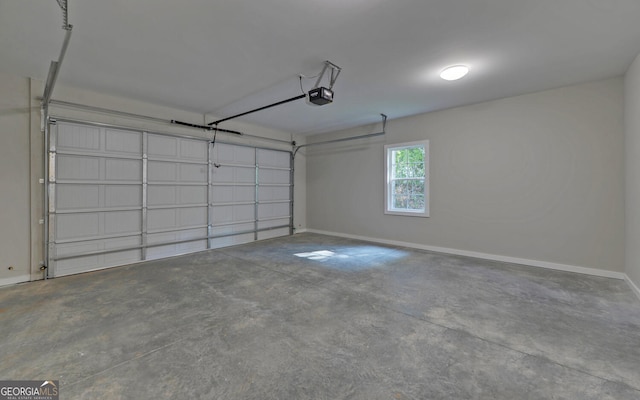 garage featuring baseboards and a garage door opener