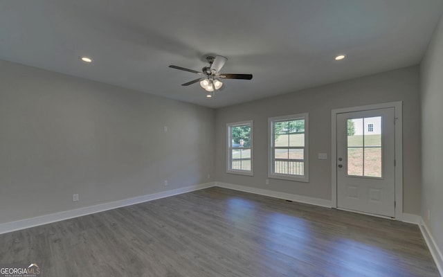 interior space with recessed lighting, dark wood-type flooring, baseboards, and ceiling fan