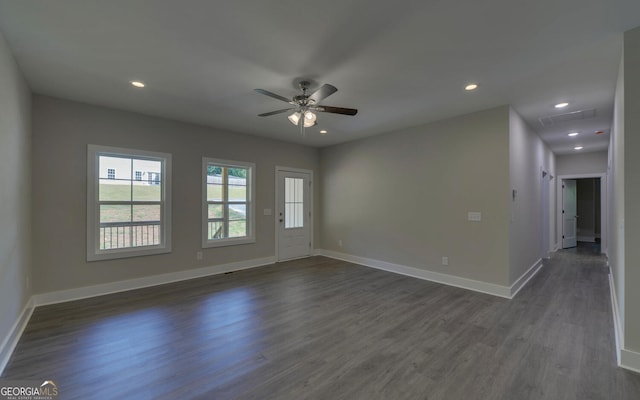 unfurnished room with ceiling fan and dark hardwood / wood-style floors