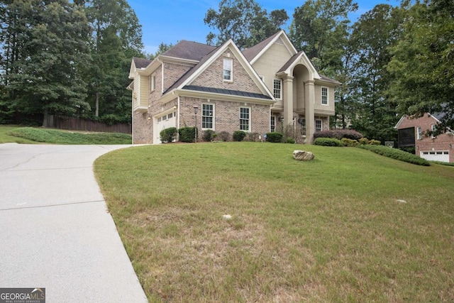 view of front of house with a garage and a front lawn