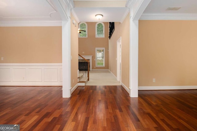 kitchen featuring a notable chandelier, appliances with stainless steel finishes, hanging light fixtures, a center island, and dark wood-type flooring