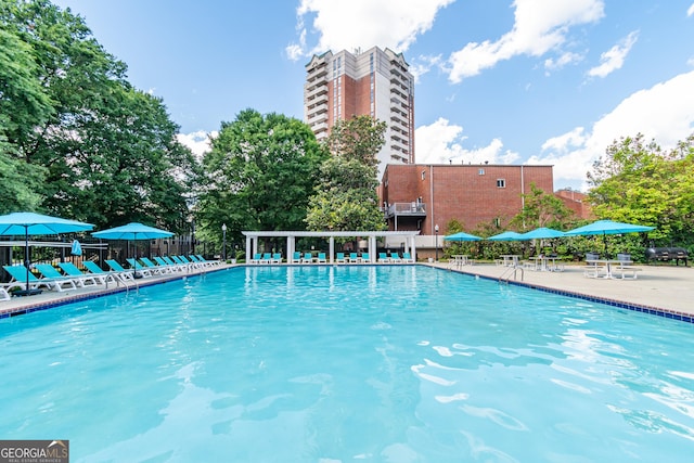 view of swimming pool with a patio