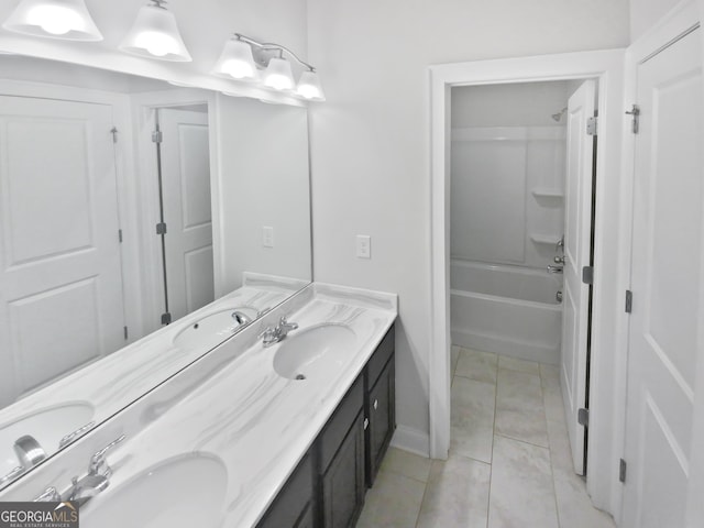 full bathroom with a sink, double vanity, and tile patterned floors