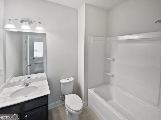 bathroom featuring tile patterned floors, baseboards, toilet, and vanity