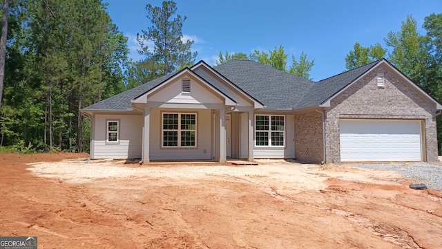 4477 Rivercliff Way, Gray, GA 31032 - view of front of house with a garage, roof with shingles, driveway, and brick siding