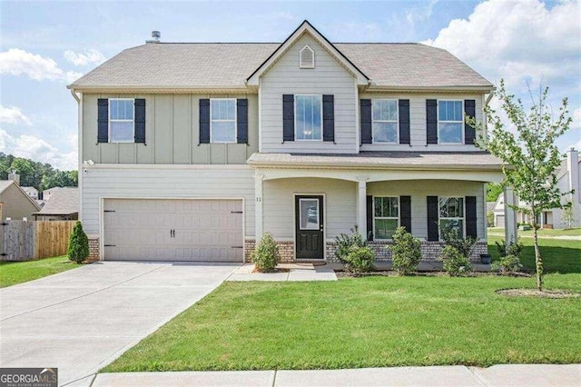 view of front facade with a front yard and a garage