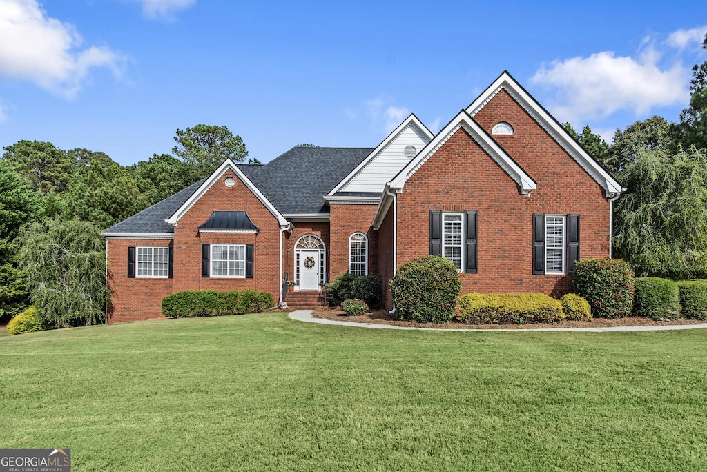 view of property with a front lawn