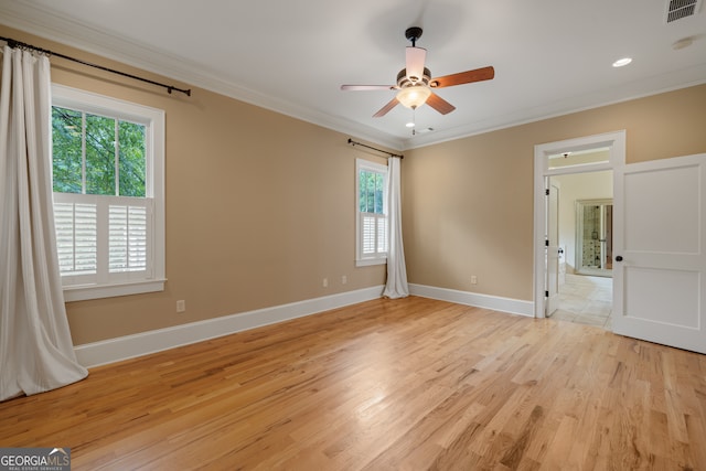 unfurnished bedroom with ceiling fan, ornamental molding, and light wood-type flooring