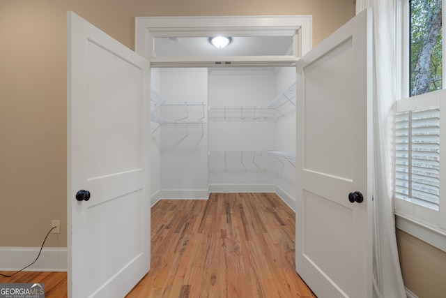 spacious closet featuring light wood-type flooring