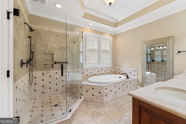 bathroom featuring vanity, a raised ceiling, tile patterned flooring, ornamental molding, and plus walk in shower