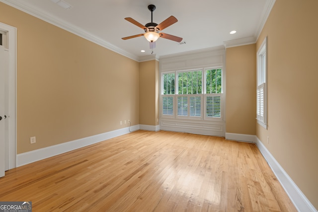 unfurnished room featuring crown molding, ceiling fan, and light hardwood / wood-style floors