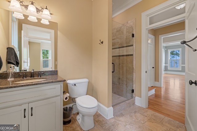 bathroom with vanity, an enclosed shower, wood-type flooring, toilet, and a healthy amount of sunlight