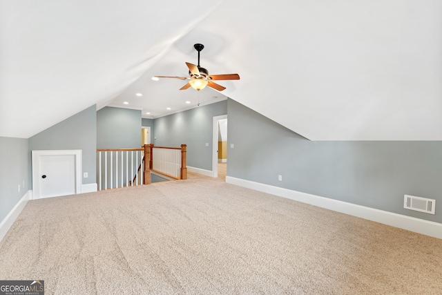 additional living space with carpet flooring, ceiling fan, and vaulted ceiling