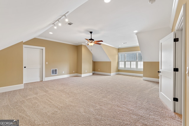 bonus room featuring ceiling fan, light carpet, and vaulted ceiling