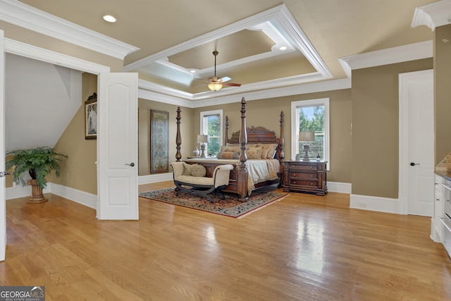 unfurnished bedroom featuring ceiling fan, ornamental molding, and light wood-type flooring