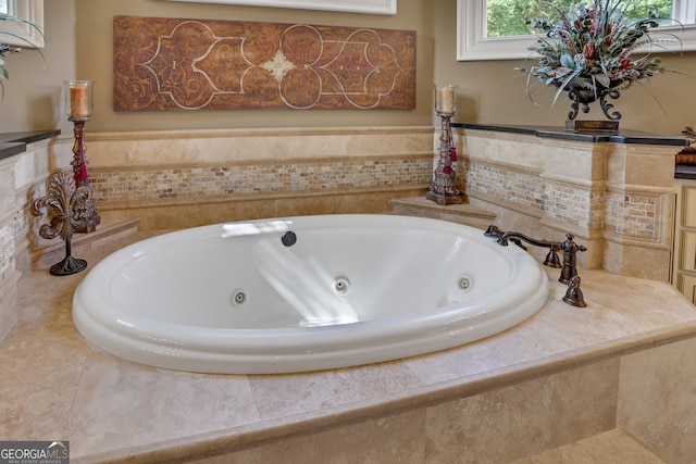 bathroom with tiled bath