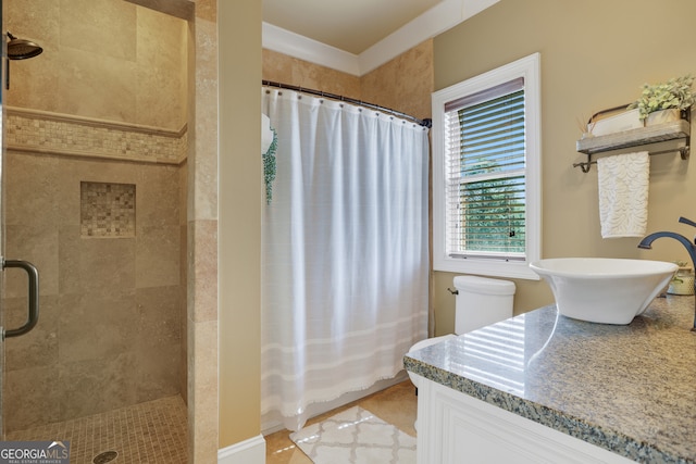 bathroom featuring tile patterned flooring, walk in shower, toilet, and vanity