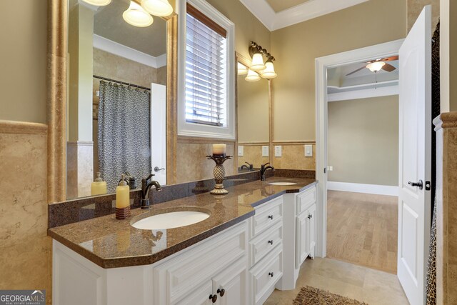 bathroom featuring ornamental molding, vanity, hardwood / wood-style floors, and ceiling fan