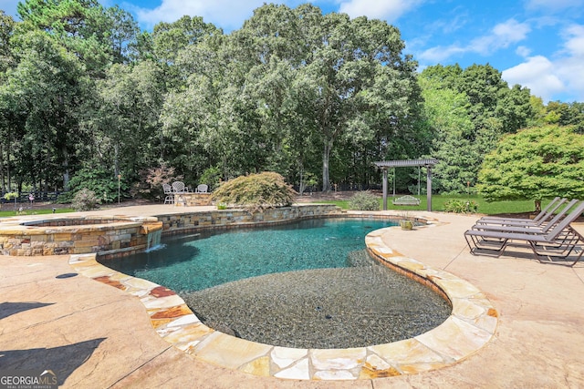 view of swimming pool with an in ground hot tub and a patio