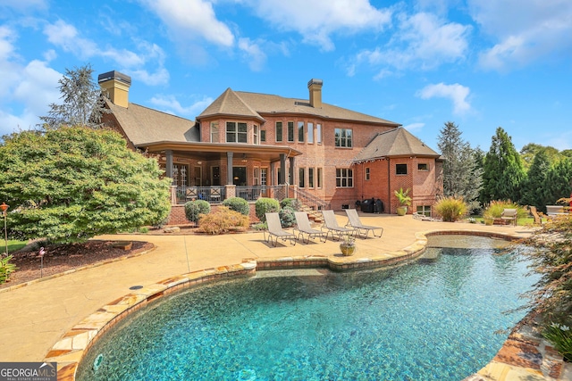 view of swimming pool featuring a patio area