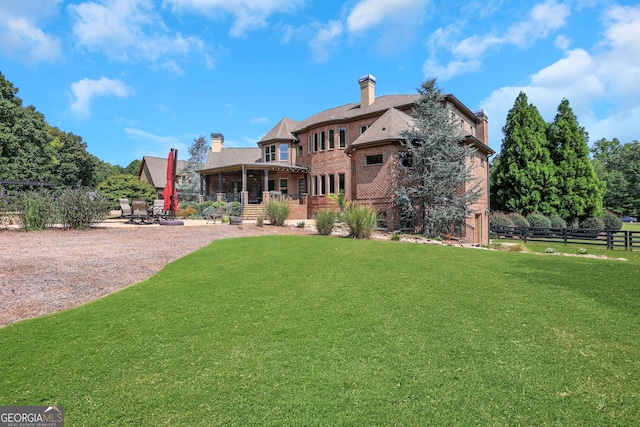 exterior space featuring a yard and a patio area