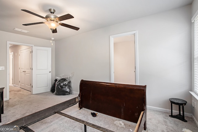 bedroom with light carpet and ceiling fan