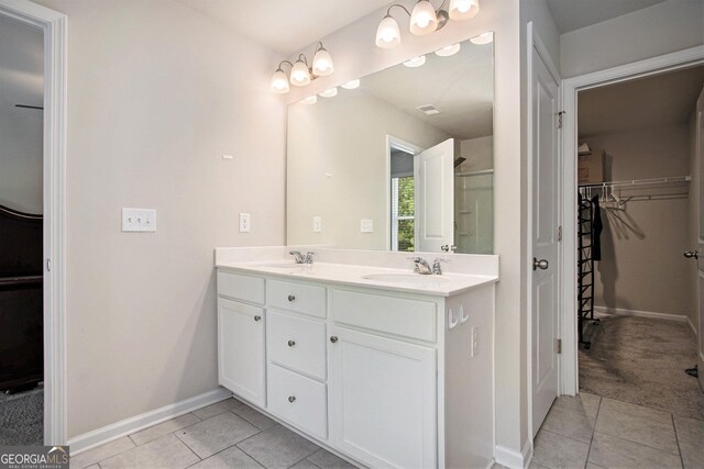 bathroom with vanity and tile patterned floors