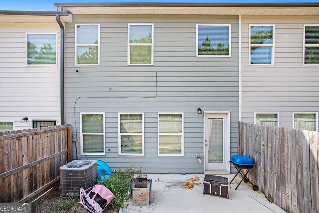 back of house featuring central AC and a patio area