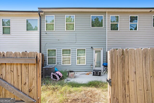 back of house with cooling unit