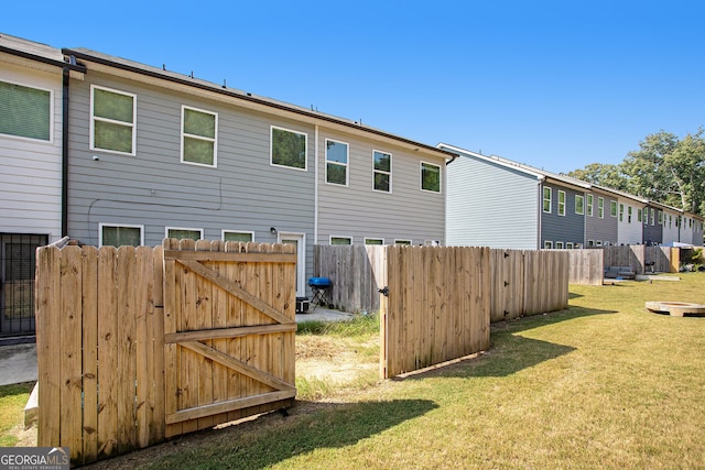 back of house with a yard