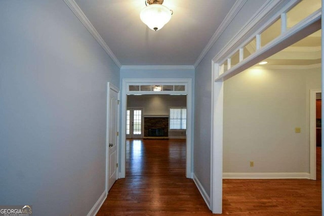 hall with ornamental molding and dark hardwood / wood-style floors