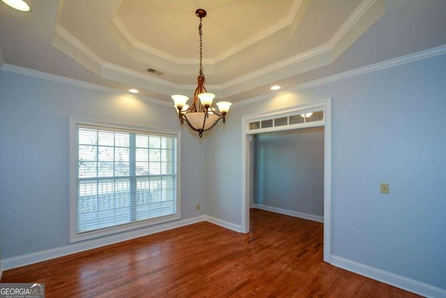 6865 Cowan Mill Rd, Winston, GA 30187 - unfurnished dining area with visible vents, baseboards, an inviting chandelier, a tray ceiling, and wood finished floors
