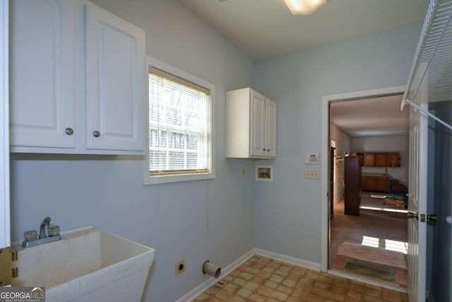 6865 Cowan Mill Rd, Winston, GA 30187 - clothes washing area with baseboards, washer hookup, a sink, cabinet space, and electric dryer hookup