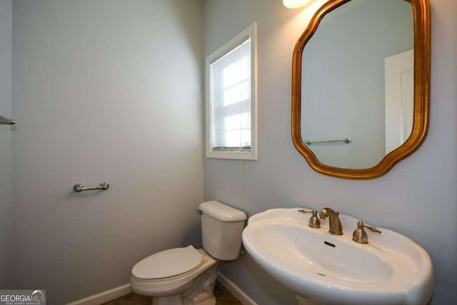 bathroom with toilet and sink