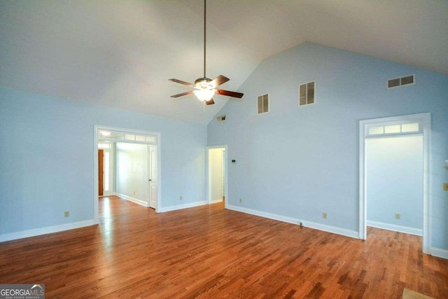 6865 Cowan Mill Rd, Winston, GA 30187 - unfurnished living room featuring visible vents, ceiling fan, high vaulted ceiling, and wood finished floors