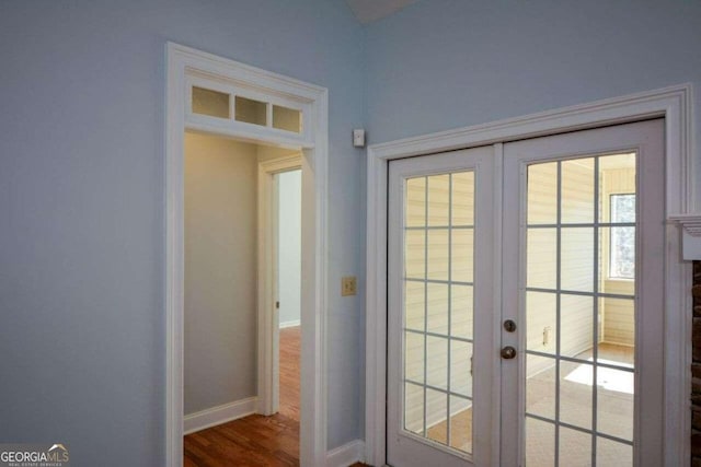 6865 Cowan Mill Rd, Winston, GA 30187 - doorway featuring dark wood-style flooring, french doors, and baseboards