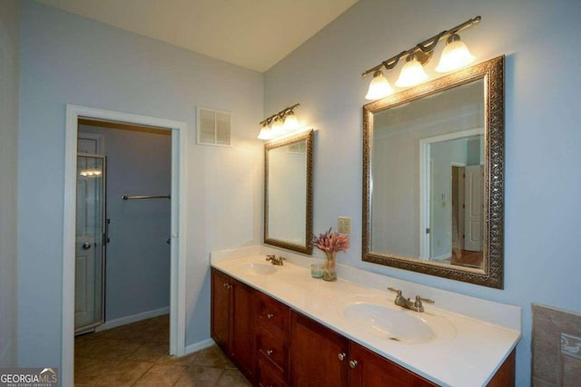 bathroom with tile patterned flooring and vanity