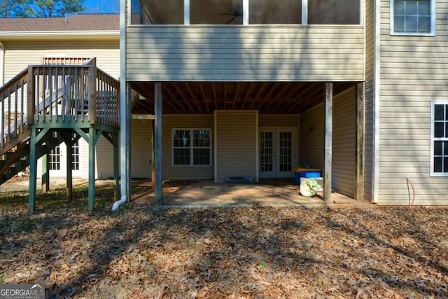 6865 Cowan Mill Rd, Winston, GA 30187 - rear view of house with french doors, stairway, and a patio