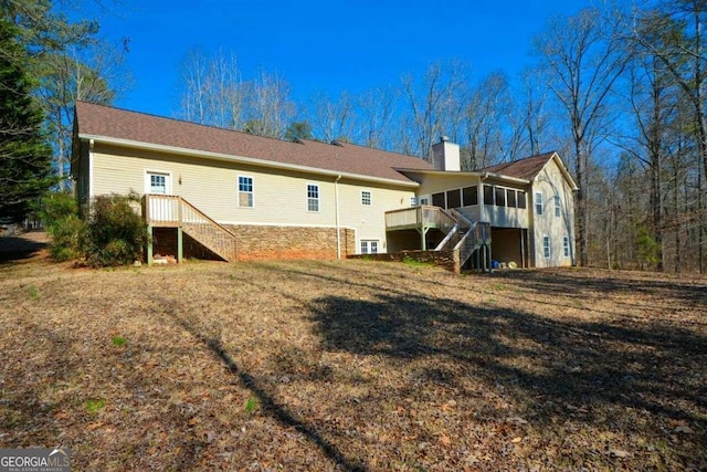 6865 Cowan Mill Rd, Winston, GA 30187 - rear view of house with a yard, a chimney, a sunroom, and stairs