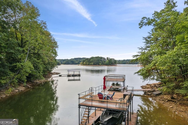 dock area with a water view and boat lift